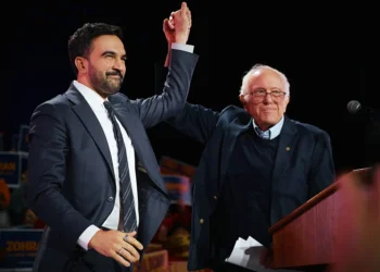 NEW YORK, NEW YORK - OCTOBER 26: New York Mayoral Candidate Zohran Mamdani celebrates with Sen. Bernie Sanders (I-VT) during an election rally with Sanders and U.S. Rep. Alexandria Ocasio-Cortez (D-NY) at Forest Hills Stadium on October 26, 2025 in the Queens borough of New York City. The mayoral election will take place on November 4, 2025. (Photo by Andres Kudacki/Getty Images)