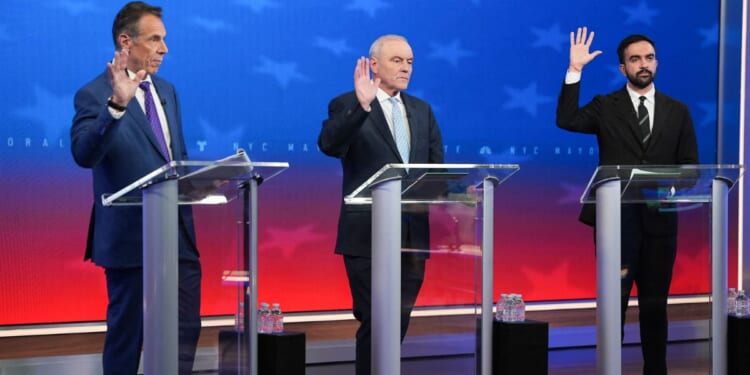 New York City mayoral candidates, Independent and former New York Gov. Andrew Cuomo, left, Republican Curtis Sliwa, center, and Democrat Zohran Mamdani debate in New York Thursday.