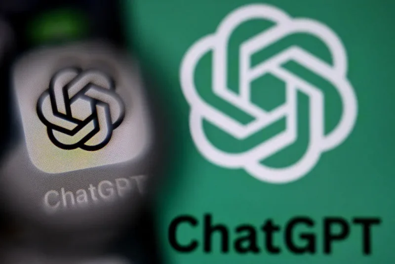 A photo taken on September 1, 2025 shows the logo of ChatGPT on a laptop screen (R) next to the ChatGPT application logo on a smartphone screen in Frankfurt am Main, western Germany. (Photo by Kirill KUDRYAVTSEV / AFP) (Photo by KIRILL KUDRYAVTSEV/AFP via Getty Images)