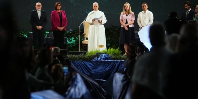 Pope Leo XIV, center, attends the International conference "Raising Hope for Climate Justice", in Castel Gandolfo, Italy, on Wednesday.