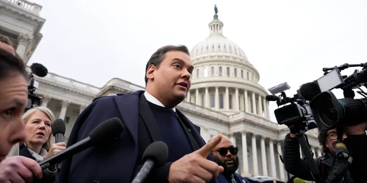 WASHINGTON, DC - DECEMBER 01: Rep. George Santos (R-NY) is surrounded by journalists as he leaves the U.S. Capitol after his fellow members of Congress voted to expel him from the House of Representatives on December 01, 2023 in Washington, DC. Charged by the U.S. Department of Justice with 23 felonies in New York including fraud and campaign finance violations, Santos, 35, was expelled from the House of Representatives by a vote of 311-114. Santos is only the sixth person in U.S. history to be expelled from the House of Representatives. (Photo by Drew Angerer/Getty Images)