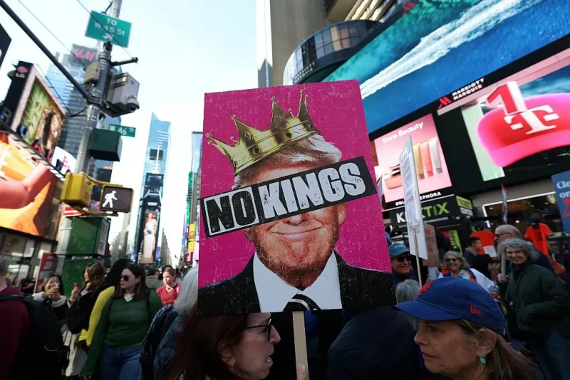 People participate in a "No Kings" national day of protest in New York on October 18, 2025. From New York to San Francisco, millions of Americans are expected to hit the streets to voice their anger over President Donald Trump's policies at nationwide "No Kings" protests. (Photo by TIMOTHY A.CLARY / AFP) (Photo by TIMOTHY A.CLARY/AFP via Getty Images)