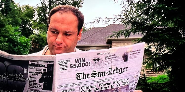 A legitimate businessman enjoys his morning paper.