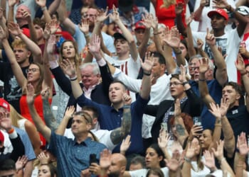 Attendees sing worship songs prior to the start of a memorial service for Charlie Kirk in Glendale, Arizona, on Sept. 21.