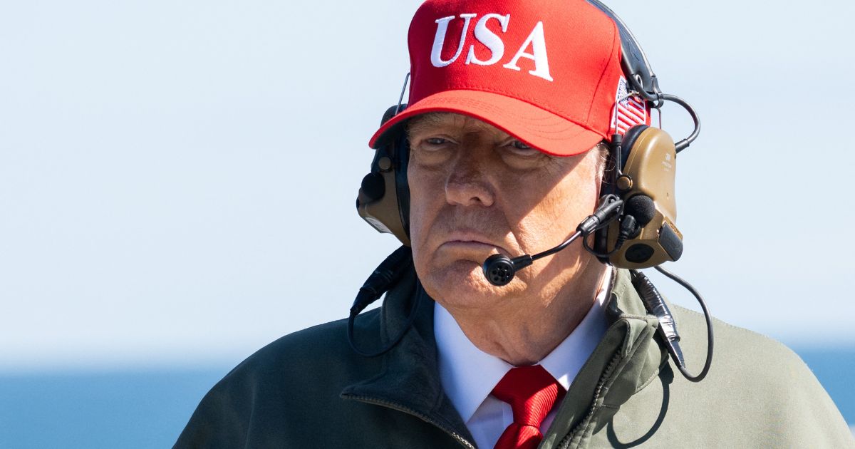 President Donald Trump visits the USS George H.W. Bush aircraft carrier near Norfolk, Virginia, as part of the U.S. Navy's 250th anniversary celebration on Sunday.