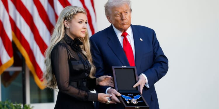President Donald Trump, right, posthumously awards the Presidential Medal of Freedom to late conservative activist Charlie Kirk as he presents the Medal to his wife Erika Kirk, left, in the Rose Garden of the White House in Washington, D.C., on Tuesday.
