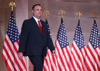 WASHINGTON, DC - AUGUST 26: For a prerecorded address for the Republican National Convention released August 27, 2020, White House Deputy Chief of Staff for Communications Dan Scavino walks onstage to speak inside the empty Mellon Auditorium August 26, 2020 in Washington, DC. The novel coronavirus pandemic has forced the Republican Party to move away from an in-person convention to a televised format, similar to the Democratic Party