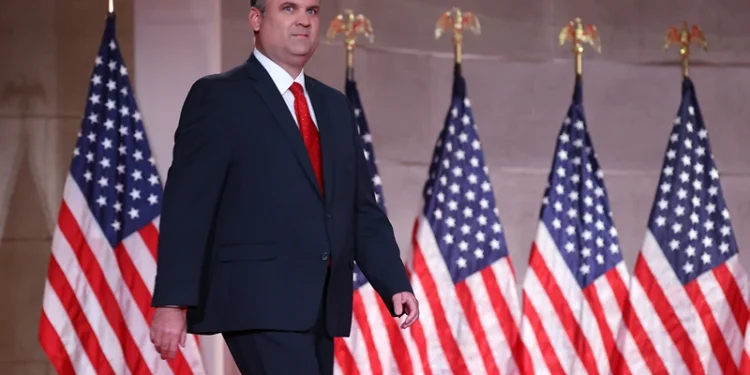 WASHINGTON, DC - AUGUST 26: For a prerecorded address for the Republican National Convention released August 27, 2020, White House Deputy Chief of Staff for Communications Dan Scavino walks onstage to speak inside the empty Mellon Auditorium August 26, 2020 in Washington, DC. The novel coronavirus pandemic has forced the Republican Party to move away from an in-person convention to a televised format, similar to the Democratic Party