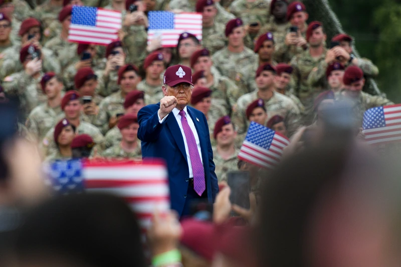 FORT BRAGG, NORTH CAROLINA - JUNE 10: U.S. President Donald Trump pumps his fist to the crowd as he leaves the stage after speaking at a rally with U.S. Army troops on June 10, 2025 at Fort Bragg, North Carolina. Trump is traveling to Fort Bragg Army base to observe a military demonstration and give remarks in honor of the U.S. Army’s 250th anniversary. (Photo by Melissa Sue Gerrits/Getty Images)