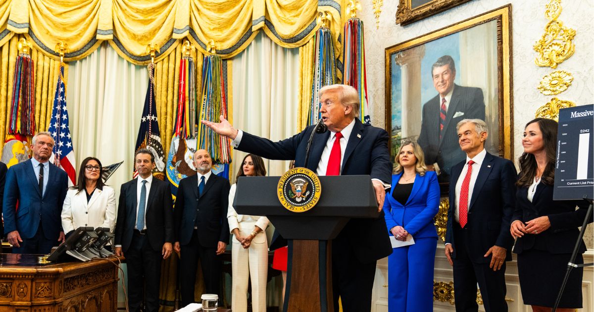 President Donald Trump answers questions from reporters during an event in the Oval Office of the White House on Thursday, Oct. 16, 2025.