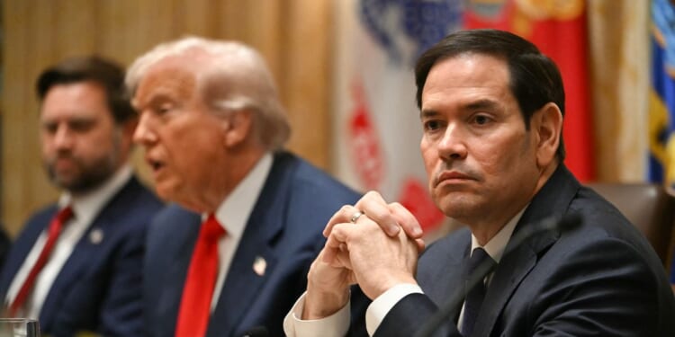 Secretary of State Marco Rubio looks on as President Donald Trump meets with Argentina's President Javier Milei in the Cabinet Room at the White House in Washington, D.C., on Oct. 14, 2025.