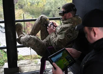 A Ukrainian serviceman (L) operates a drone during the