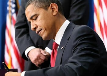 Media Name: obama-signs.jpg