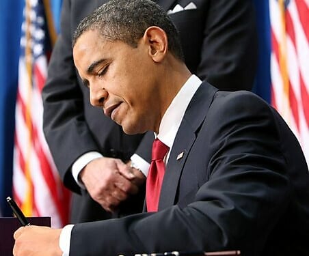 Media Name: obama-signs.jpg