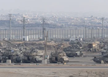 SOUTHERN ISRAEL, ISRAEL - OCTOBER 29: Israeli tanks stand near the border with the Gaza Strip as seen from a position on the Israeli side of the border on October 29, 2025 in Southern Israel, Israel. Israeli Prime Minister Benjamin Netanyahu ordered "immediate, powerful" strikes on Gaza Tuesday, after his office accused Hamas of violating the terms of the ceasefire agreement for returning remains that Israel says do not belong to any of the 13 unaccounted for hostages. The announcement of strikes followed reports of fighting in Rafah near the "yellow line" demarcating territory under IDF control in Gaza, according to the US-brokered ceasefire agreement that came into affect on October 10. (Photo by Amir Levy/Getty Images)