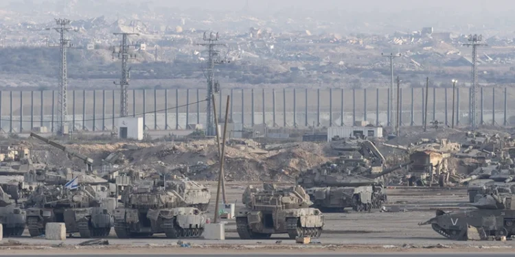 SOUTHERN ISRAEL, ISRAEL - OCTOBER 29: Israeli tanks stand near the border with the Gaza Strip as seen from a position on the Israeli side of the border on October 29, 2025 in Southern Israel, Israel. Israeli Prime Minister Benjamin Netanyahu ordered "immediate, powerful" strikes on Gaza Tuesday, after his office accused Hamas of violating the terms of the ceasefire agreement for returning remains that Israel says do not belong to any of the 13 unaccounted for hostages. The announcement of strikes followed reports of fighting in Rafah near the "yellow line" demarcating territory under IDF control in Gaza, according to the US-brokered ceasefire agreement that came into affect on October 10. (Photo by Amir Levy/Getty Images)