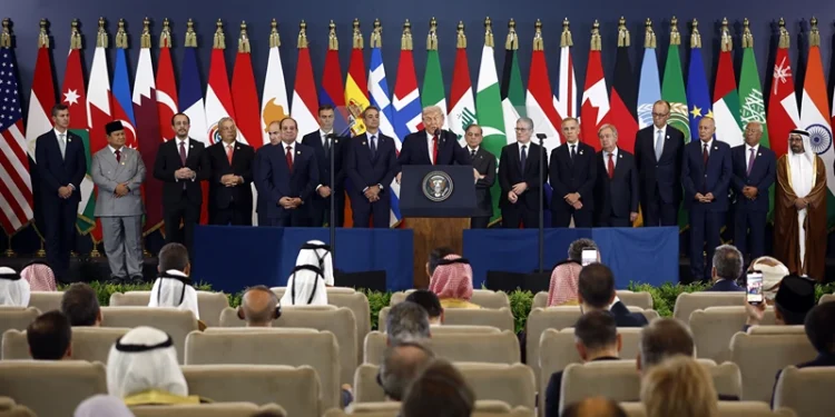 US President Donald Trump (C) delivers a statement during a summit on Gaza in Sharm el-Sheikh on October 13, 2025. US President Donald Trump hailed a "tremendous day for the Middle East" as he and regional leaders signed a declaration on October 13, 2025 meant to cement a ceasefire in Gaza, hours after Israel and Hamas exchanged hostages and prisoners. (Photo by Yoan VALAT / POOL / AFP) (Photo by YOAN VALAT/POOL/AFP via Getty Images)