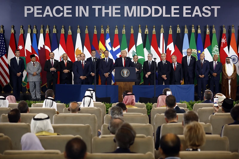 US President Donald Trump (C) delivers a statement during a summit on Gaza in Sharm el-Sheikh on October 13, 2025. US President Donald Trump hailed a "tremendous day for the Middle East" as he and regional leaders signed a declaration on October 13, 2025 meant to cement a ceasefire in Gaza, hours after Israel and Hamas exchanged hostages and prisoners. (Photo by Yoan VALAT / POOL / AFP) (Photo by YOAN VALAT/POOL/AFP via Getty Images)