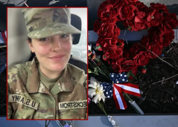 A makeshift memorial has been set up in honor of the two National Guard service members shot near the Farragut West Metro Station in Washington, DC on November 28, 2025, two days after a shooting killed one National Guard member and critically wounded another. Two National Guard troops were shot on November 26 near the White House in what authorities described as a targeted attack by an Afghan migrant who had previously worked with the US military in Afghanistan, a case now being treated as a terrorism investigation, after President Donald Trump said on November 27 that one of the soldiers, Sarah Beckstrom, had died and the other was fighting for his life. (Photo by Brendan SMIALOWSKI / AFP via Getty Images) / U.S. Army Specialist Sarah Beckstrom (Department of Justice)