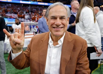 ATLANTA, GEORGIA - JANUARY 01: Texas Governor Greg Abbott poses on the field prior to the Chick-fil-A Peach Bowl between the Texas Longhorns and Arizona State Sun Devils at Mercedes-Benz Stadium on January 01, 2025 in Atlanta, Georgia. (Photo by Todd Kirkland/Getty Images)
