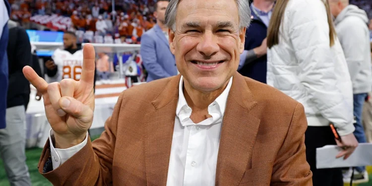 ATLANTA, GEORGIA - JANUARY 01: Texas Governor Greg Abbott poses on the field prior to the Chick-fil-A Peach Bowl between the Texas Longhorns and Arizona State Sun Devils at Mercedes-Benz Stadium on January 01, 2025 in Atlanta, Georgia. (Photo by Todd Kirkland/Getty Images)