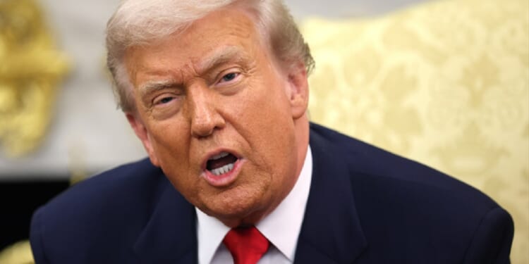 President Donald Trump, pictured in the Oval Office on Tuesday, took to social media over the weekend to declare that Chicago residents are begging for federal help against crime.