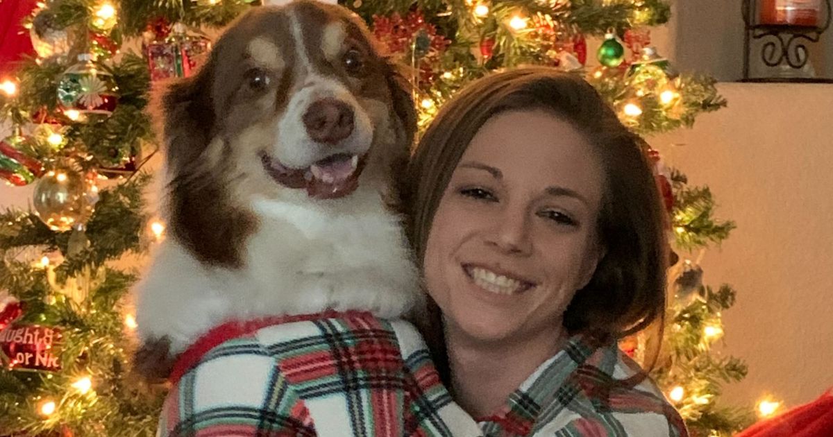 The Western Journal Supervising Story Editor Kassandra White poses for a Christmas photo with her dog Keller, affectionately called "The Floof."