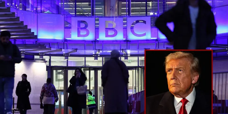 People use the entrance to the offices of British broadcaster BBC in London in the late afternoon on November 11, 2025. The BBC