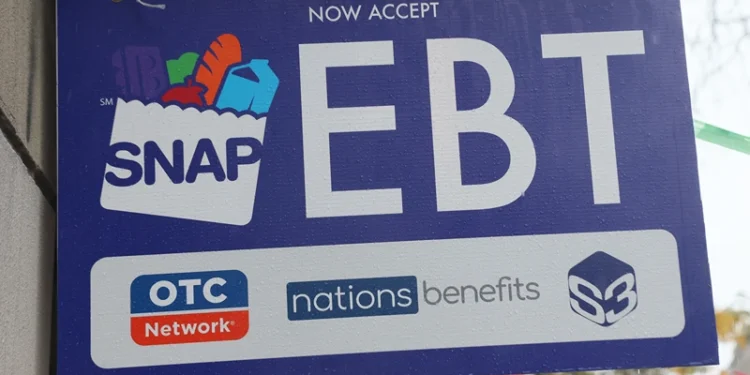 NEW YORK, NEW YORK - OCTOBER 30: An EBT sign is displayed on the window of a grocery store on October 30, 2025 in the Flatbush neighborhood of the Brooklyn borough in New York City. Supplemental Nutrition Assistance Program (SNAP) benefits and other assistance are set to stop on November 1st amid a federal government shutdown that has been going on for 29 days and is the second-longest shutdown in the nation