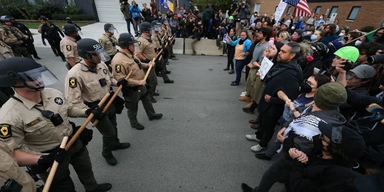 BROADVIEW, ILLINOIS - OCTOBER 17: Police interact with demonstrators near the "Free Speech Zone" outside of the immigrant processing and detention center on October 17, 2025, in Broadview, Illinois. Demonstrations have been taking place outside of the facility for several weeks as the Trump administration