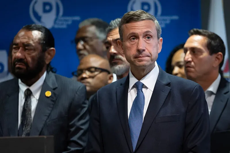 AURORA, ILLINOIS - AUGUST 05: Ken Martin, chairman of the Democratic National Committee, listens to speakers during a press conference with Texas Democrats at the International Union of Painters and Allied Trades union hall on August 05, 2025 in Aurora, Illinois. Democratic Texas lawmakers left the state on Sunday to prevent a quorum from being reached during a special session called to redistrict the state in favor of Republican candidates. (Photo by Scott Olson/Getty Images)