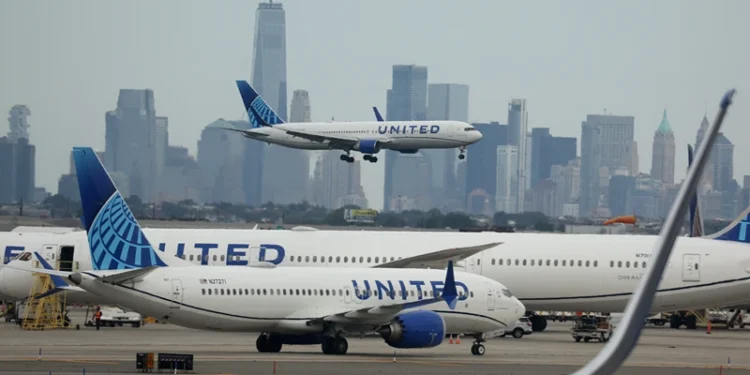NEWARK, NEW JERSEY - SEPTEMBER 17: A United Airlines plane lands at Newark Liberty International Airport in front of the New York skyline on September 17, 2023 in Newark, New Jersey. (Photo by Justin Sullivan/Getty Images)