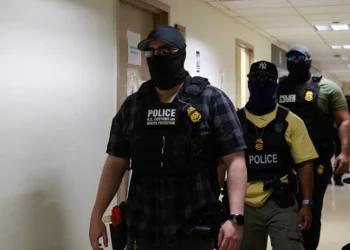 U.S. federal agents working for Immigration and Customs Enforcement (ICE) detain immigrants and asylum seekers reporting for immigration court proceedings at the Jacob K. Javits Federal Building