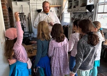 Scholé students visiting a founder.