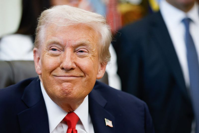 U.S. President Donald Trump listens to other speakers after delivering remarks during an event in the Oval Office of the White House on October 16, 2025 in Washington, DC. Trump outlined plans to expand vitro fertilization (IVF) access by encouraging workplace benefits to include access to IVF and infertility coverage. (Photo by Kevin Dietsch/Getty Images)