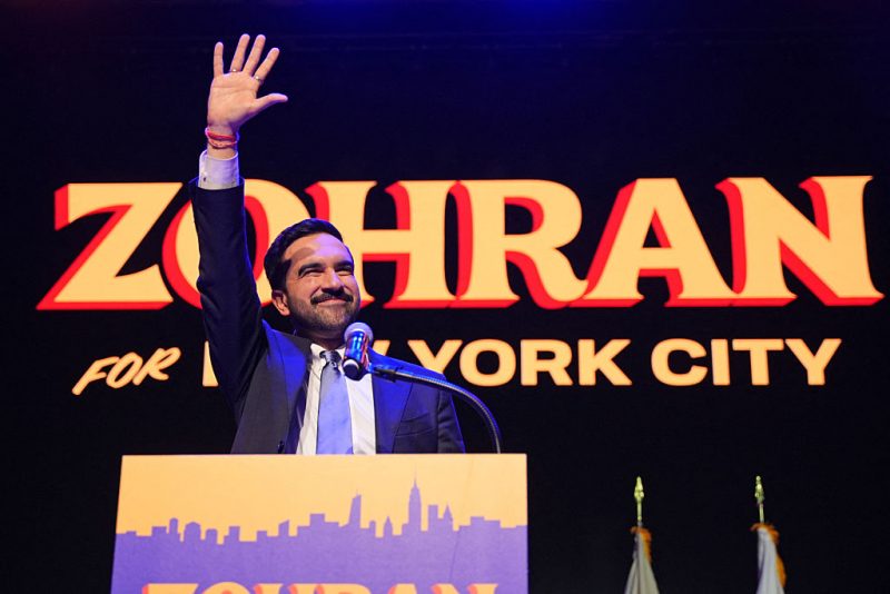 TOPSHOT - New York City Mayoral candidate Zohran Mamdani celebrates during an election night event at the Brooklyn Paramount Theater in Brooklyn, New York on November 4, 2025. New Yorkers elected leftist Zohran Mamdani as their next mayor November 4, 2025 broadcasters projected, on a day of key local ballots across the country offering the first electoral judgement of Donald Trump's tumultuous second White House term. (Photo by Angelina Katsanis / AFP) (Photo by ANGELINA KATSANIS/AFP via Getty Images)