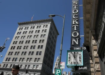 STOCKTON, CA - JUNE 27: A pedestrian walks by the vacant Bank of Stockton on June 27, 2012 in Stockton, California. Members of the Stockton city council voted 6-1 on Tuesday to adopt a spending plan for operating under Chapter 9 bankruptcy protection following failed talks with bondholders and labor unions failed. The move will make Stockton the biggest U.S. city to file for bankruptcy protection from creditors. (Photo by Justin Sullivan/Getty Images)