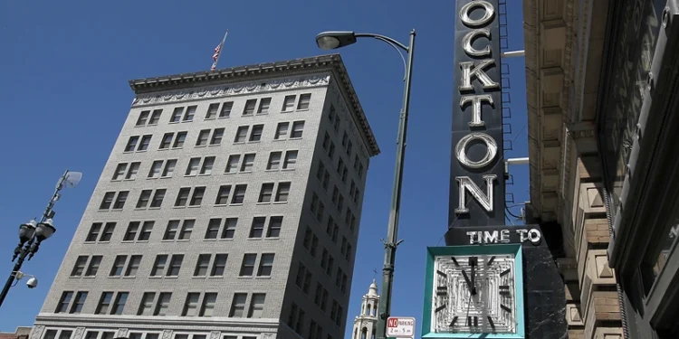 STOCKTON, CA - JUNE 27: A pedestrian walks by the vacant Bank of Stockton on June 27, 2012 in Stockton, California. Members of the Stockton city council voted 6-1 on Tuesday to adopt a spending plan for operating under Chapter 9 bankruptcy protection following failed talks with bondholders and labor unions failed. The move will make Stockton the biggest U.S. city to file for bankruptcy protection from creditors. (Photo by Justin Sullivan/Getty Images)