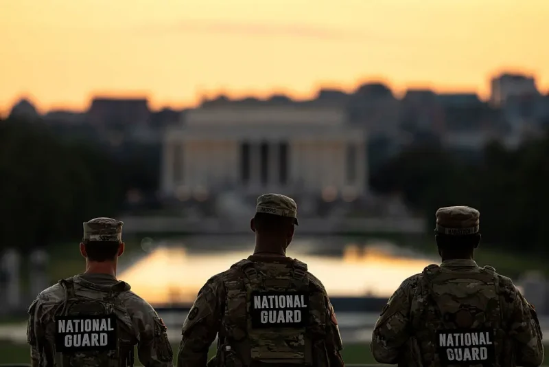WASHINGTON, DC - SEPTEMBER 2: Members of the National Guard are seen standing near the Washington Monument, on September 02, 2025 in Washington, DC. Members of the National Guard and Federal Law Enforcement continue to patrol the Nation's Capital, weeks after U.S. President Donald Trump ordered the National Guard and law enforcement to patrol the nation's capital to assist in crime prevention with more than 2,200 National Guard troops have been deployed in Washington, D.C., a mission that experts estimate is costing over $1 million a day when factoring in pay, housing, travel, food, fuel and other logistics, according to comparisons with the 2020 mobilization of 5,000 Guard members that cost more than $2 million daily. (Photo by Kent Nishimura/Getty Images)