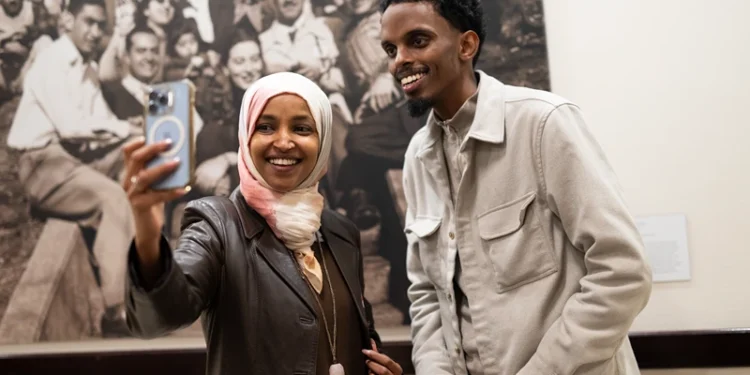 MINNEAPOLIS, MINNESOTA - NOVEMBER 4: Minneapolis mayoral candidate State Senator Omar Fateh (R) records an Instagram live video with Rep. Ilhan Omar (D-MN) as he campaigns on Election Day at the University of Minnesota on November 4, 2025 in Minneapolis, Minnesota. Incumbent Mayor Jacob Frey is seeking reelection to his third term in office as he is opposed by three other local Democrats. (Photo by Stephen Maturen/Getty Images)