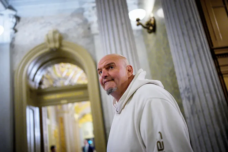 WASHINGTON, DC - NOVEMBER 10: U.S. Sen. John Fetterman (D-PA), one of eight Democrats to say he will vote with Republicans to open the government, arrives for votes on November 10, 2025 on Capitol Hill in Washington, DC. The Senate reached a deal late Sunday to fund the government, aiming to end the longest shutdown in history. (Photo by Andrew Harnik/Getty Images)