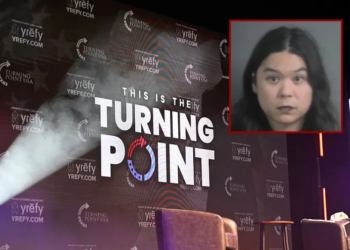The Turning Point USA logo is seen on the stage during an "American Comeback Tour" stop in Burruss Hall at Virgina Tech university in Blacksburg, Virginia, on September 24, 2025. The event is being held two weeks after the killing of right-wing activist and co-founder of Turning Point USA Charlie Kirk during an "American Comeback Tour" stop in Orem, Utah on September 10. (Photo by Alex WROBLEWSKI / AFP) (Photo by ALEX WROBLEWSKI/AFP via Getty Images) / Justin Pham Calhoon