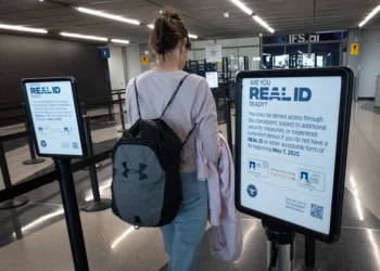 CHICAGO, ILLINOIS - MAY 07: A passenger enters a security checkpoint where travelers who are not compliant with Real ID changes for air travel are directed at O
