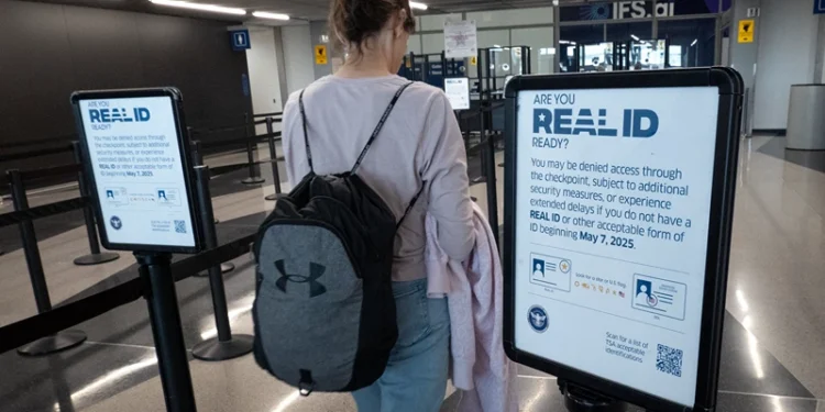 CHICAGO, ILLINOIS - MAY 07: A passenger enters a security checkpoint where travelers who are not compliant with Real ID changes for air travel are directed at O