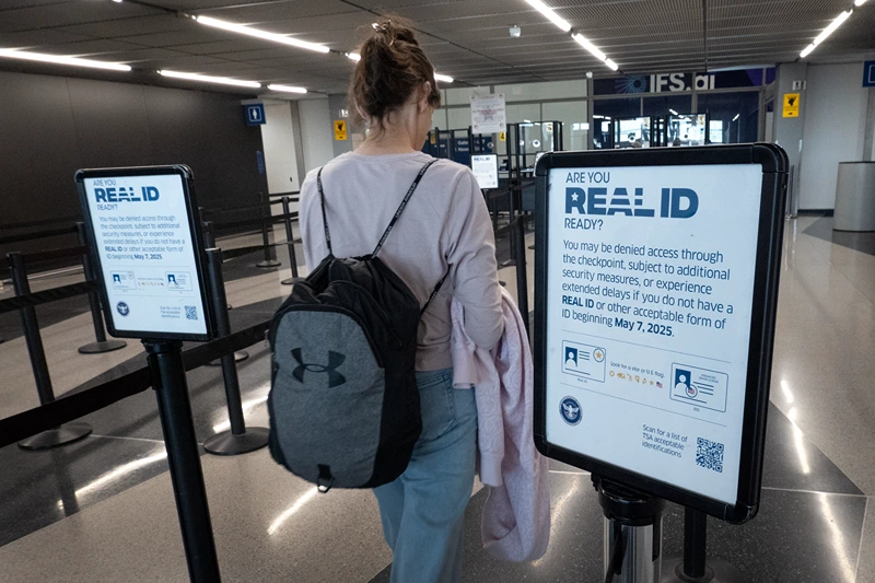 CHICAGO, ILLINOIS - MAY 07: A passenger enters a security checkpoint where travelers who are not compliant with Real ID changes for air travel are directed at O