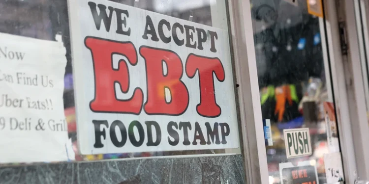NEW YORK, NEW YORK - OCTOBER 30: An EBT sign is displayed on the window of a grocery store on October 30, 2025 in the Flatbush neighborhood of the Brooklyn borough in New York City. Supplemental Nutrition Assistance Program (SNAP) benefits and other assistance are set to stop on November 1st amid a federal government shutdown that has been going on for 29 days and is the second-longest shutdown in the nation