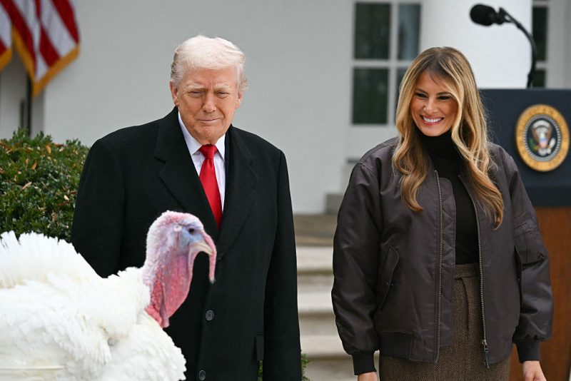 First Lady Melania Trump looks on as US President Donald Trump prepares to pardon Gobble, one of the National Thanksgiving turkeys, during the White House turkey pardon ceremony in the Rose Garden of the White House in Washington, DC on November 25, 2025. (Photo by ANDREW CABALLERO-REYNOLDS / AFP via Getty Images)