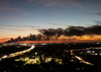 TOPSHOT - Smoke rises from the site of a UPS cargo plane crash near the UPS Worldport at Louisville Muhammad Ali International Airport in Louisville, Kentucky, on November 4, 2025. A UPS cargo plane crashed on the evening of November 11 near the Louisville International Airport shortly after takeoff, the US Federal Aviation Administration (FAA) said, as local media in the Kentucky city aired video of a large plume of smoke rising above the facility."UPS Flight 2976 crashed around 5:15 p.m. local time," the FAA said, identifying the aircraft as a McDonnell Douglas MD-11 headed to Hawaii. (Photo by LEANDRO LOZADA / AFP) / ALTERNATE CROP (Photo by LEANDRO LOZADA/AFP via Getty Images)