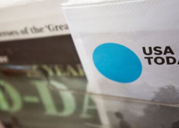 A copy of a special edition of USA Today sits in a display at a convenience store in Washington, DC on Aug. 6, 2019.
