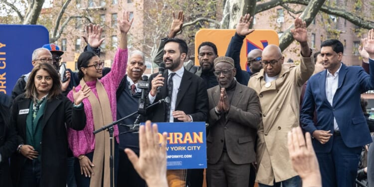 Democratic New York City mayoral candidate Zohran Mamdani, center, asked rally goers Saturday to raise their hands if they'd been accused of being a terrorist.